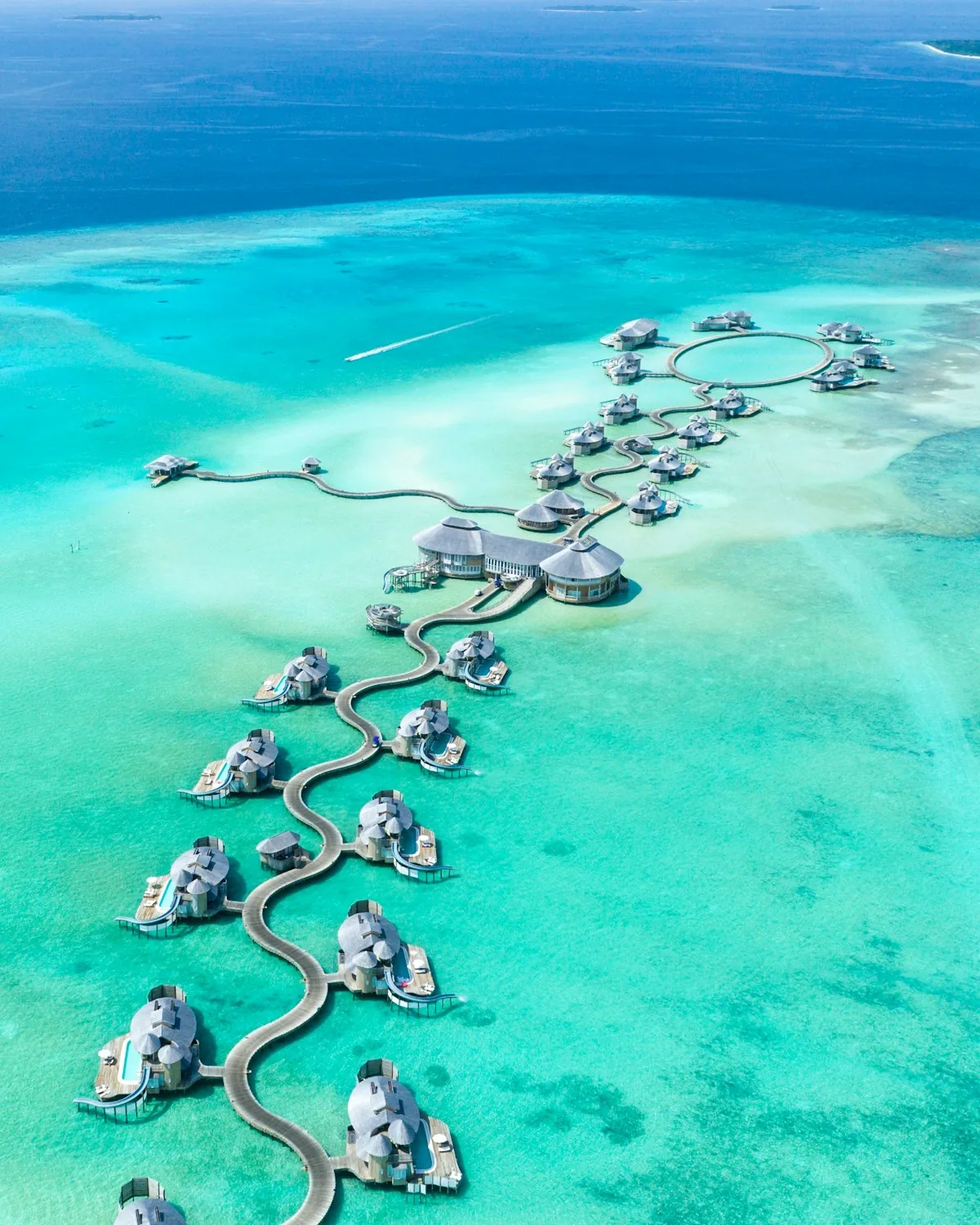 Maldives overwater villa turquoise lagoon package